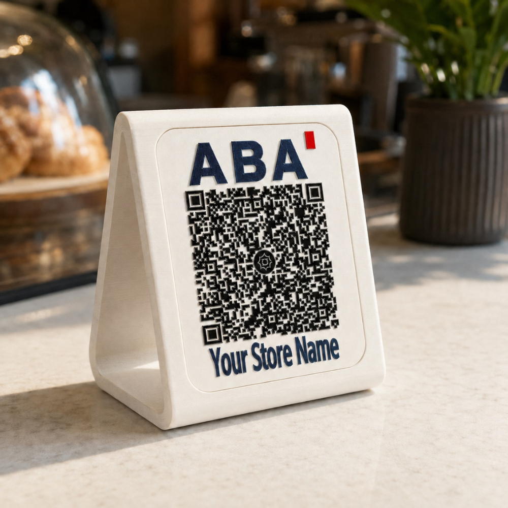 3D printed ABA KHQR payment stand on a cafe counter